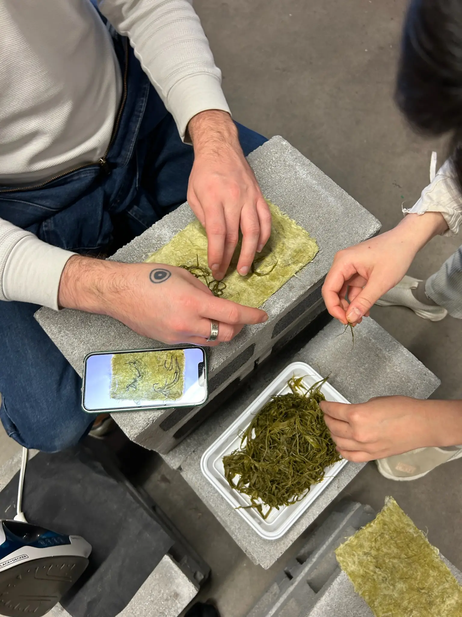 Emi and Nik and the dog-strangling vine that will become the Ksha-sha — part of the Organima series. Ksha-sha was made in close collaboration with Masumi Rodriguez and Elena Kirby. Photo by Masumi.